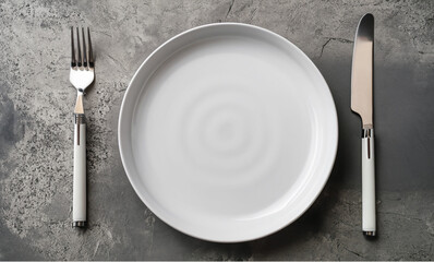 plate and cutlery, White plate, cutlery on stone table, Table setting, flat lay image 