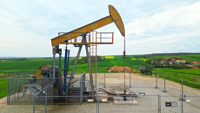 Motionless Pumpjack In The Oil Field Of Austrian Petroleum Town Of Zisterdorf. elevated zoom-in