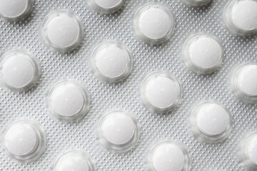 Close up of pills of blister pack on table 