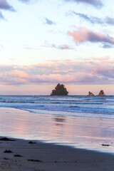 Dazzling sunset over Whangamata Beach, New Zealand