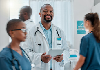 Busy hospital, tablet and portrait of doctor for medical care, wellness app and support with blur of people. Healthcare, digital tech and happy black man for service, consulting and health insurance