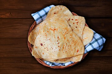 Triangle shape Plain Parotha or namak Parantha or tel paratha is an Indian flatbread made of...