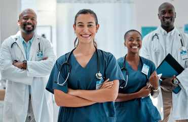 Teamwork, happy and portrait of doctors with crossed arms for medical care, wellness and support. Healthcare, hospital and men and women health workers for cardiology service, consulting or insurance