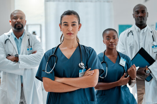 Hospital, serious team and portrait of doctors with crossed arms for medical care, wellness and support. Healthcare, clinic and men and women workers for cardiology service, consulting and insurance