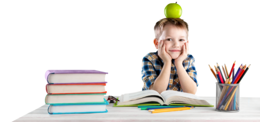 Happy school child with school supplies, sitting at a desk learning in class