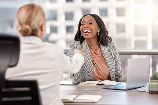 Young, businesswoman and shake hands or interview for new job or meeting management and in the office. Partnership, human resource and female worker hired or success or team approved in the workplace