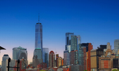 Fototapeta na wymiar Beautiful sunrise sky view with high skyscraper in New York City.