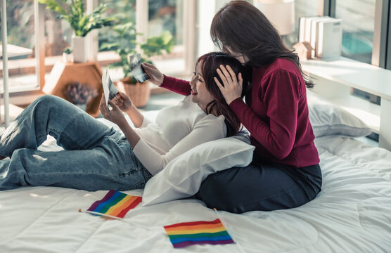 Lesbian couples feel happy, glad, excited when they get ultrasound images of their baby's gender, health, and progress in the mother's womb. Surrogacy of infertility families in modern LGBT families.