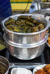 stewed snails with vegetables and lemongrass in bamboo in vietnamese night market
