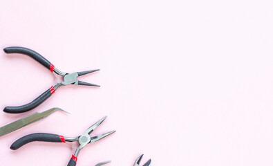 pliers, pliers, round pliers, tweezers, tools for jewelry and jewelry creation. dIY. background with space for text.