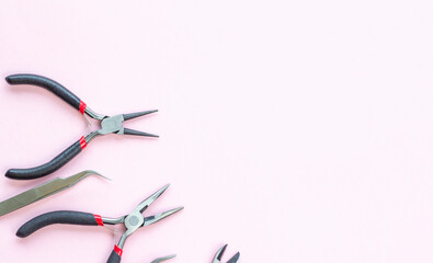 pliers, pliers, round pliers, tweezers, tools for jewelry and jewelry creation. dIY. background...