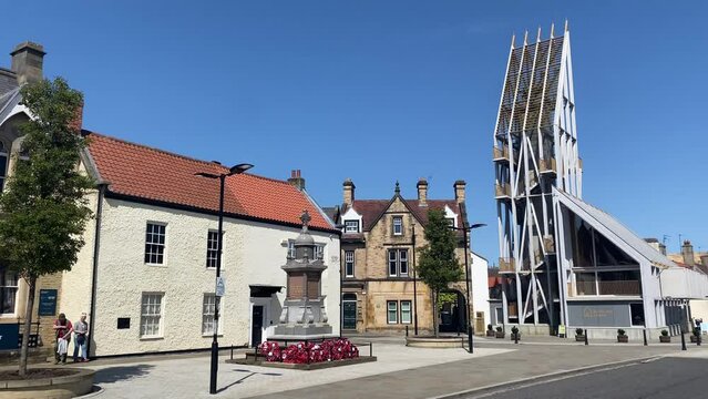 Auckland Tower, in Bishop Auckland Market Place on a bright sunny day. Panning shot from left to right.