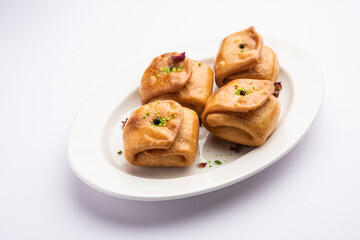 Lavang Latika: traditional Indian sweet. Crescent shape, deep-fried, soaked in sugar syrup. Served during festivals.