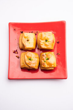 Lavang Latika: traditional Indian sweet. Crescent shape, deep-fried, soaked in sugar syrup. Served during festivals.