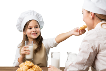 The beautiful young mother and her little daughter cook at home