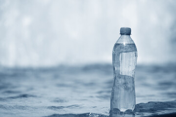 bottle of water near fountain