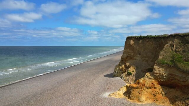Aerial view of eroded sea cliffs and beach on the Norfolk coast. Weybourne Beach, Weybourne, Norfolk, UK.