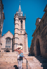 Fototapeta premium Woman is walking in the old town Morlaix- France