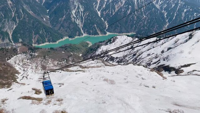 A ropeway cable car coming. The ropeway cable car is a mode of transportation on the Tateyama Kurobe Alpine Line in Japan.