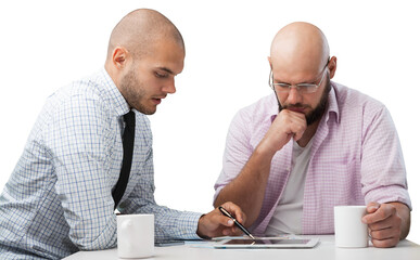 Team of serious businesspeople working on office desk