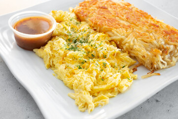 A view of a scramble egg breakfast plate.