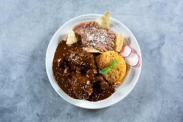 A top down view of a plate of chicken mole.