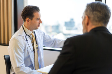 Man doctor wearing uniform with stethoscope service help support discussing and consulting talk to sick senior man patient about checkup result information in hospital.healthcare and medicine