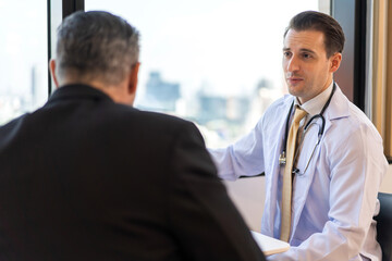 Obraz premium Man doctor wearing uniform with stethoscope service help support discussing and consulting talk to sick senior man patient about checkup result information in hospital.healthcare and medicine