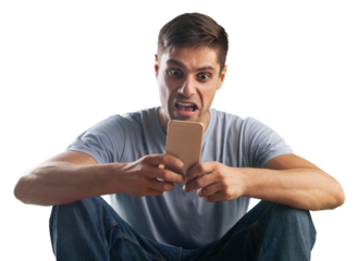 Shocked young man looking at his mobile phone seeing bad news or reading text message