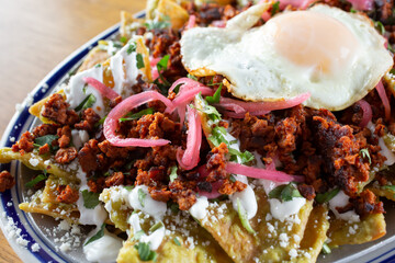 A closeup view of a plate of chilaquiles.