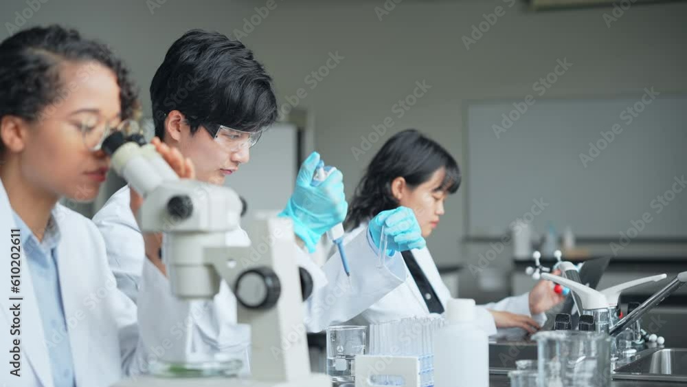 Poster multinational researcher group experimenting in the lab.