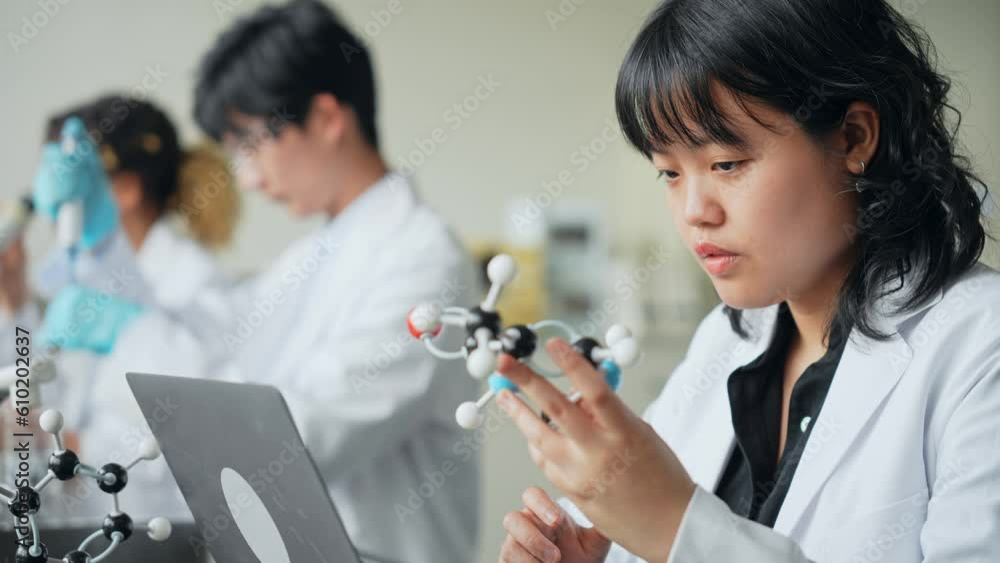 Poster multinational researcher group experimenting in the lab.