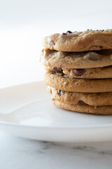 A view of a stack of chocolate chip cookies.