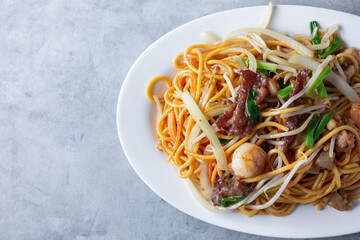 A top down view of a plate of chow mein.