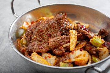 A view of a bowl of Szechuan beef.