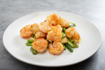 A view of a plate of scallop and shrimp.