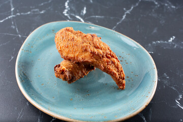 A view of a plate of chicken tenders.