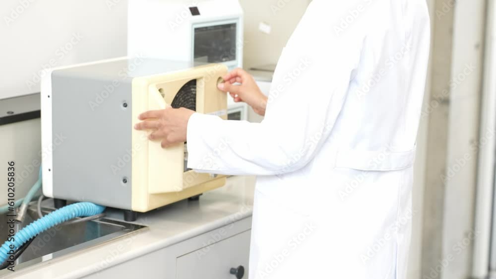 Poster group of researcher using experimental equipment.