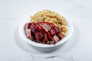 A view of a 1 item combo of Chinese fast food, featuring BBQ pork and fried rice.