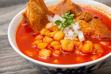 A closeup view of a bowl of pozole.