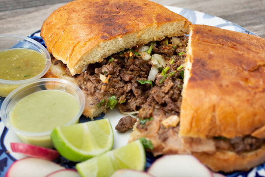 A closeup view of a carne asada torta plate.