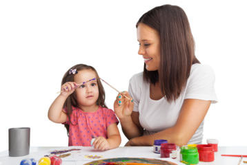 Happy young mother and daughter painting