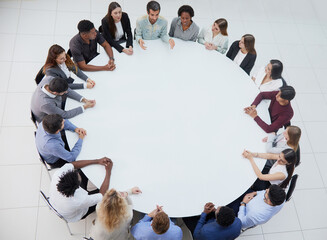 Business people having a meeting at round table