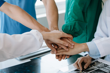 Team Doctors nurses union coordinate hands Teamwork Concept in hospital for success and trust in...