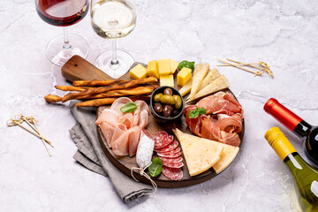 Fototapeta na wymiar Antipasto board with meat and cheese snacks