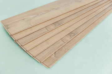 Installing laminated or wood parquet on floor, wooden tile