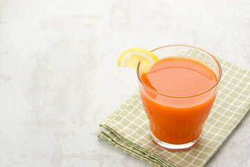 A glass of fresh juice, mix carrot, lemon and pineapple. Served in glass. Cold Pressed Juice
