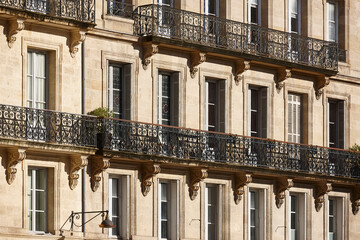 Classic urban building stine facade in Bordeaux. Aquitaine, France