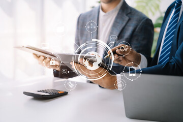 Person typing laptop computer and tablet with SDK icon on virtual screen. SDK Software development kit programming language technology concept in office.