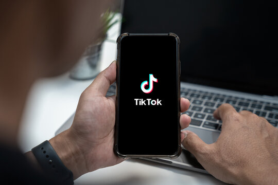 Closed up image of a male using tiktok application on a smartphone in home. 6 June, 2023. ChiangMai, Thailand.